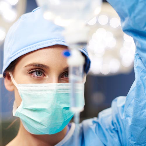 Female anesthesiologist during an operation